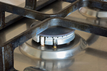 Gas stove with extinguished burner