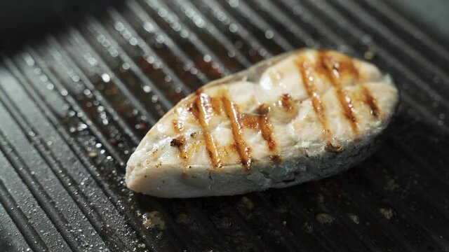 Turning a seared salman steak over on the grill and smelling that barbecue smoke.