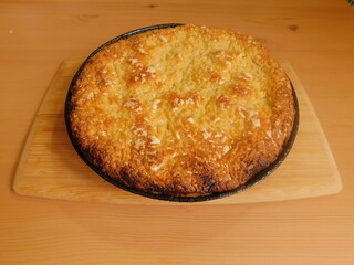 Freshly baked hot apple pie on wooden table