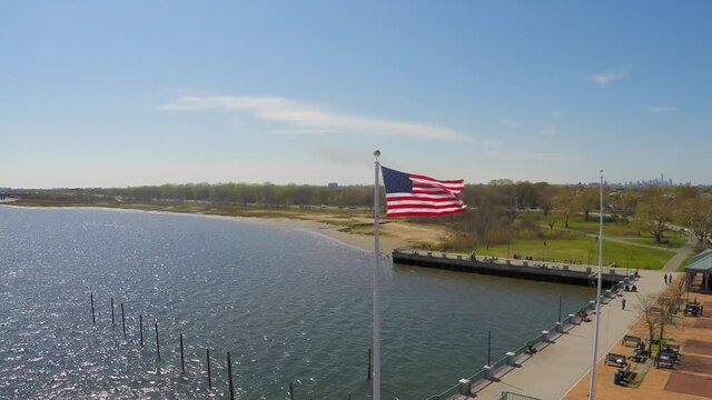 This is an aerial view of an American flag at Canarsie Pier in Brooklyn, New York. 