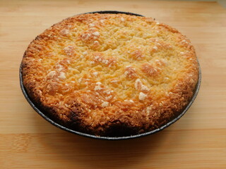 Freshly baked hot apple pie on wooden table