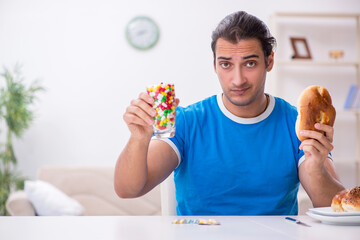 Young hungry man in dieting concept