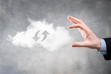 Cloud technology. Polygonal wireframe cloud storage sign with two arrows up and down on dark ....