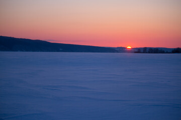 Sunset over the winter field