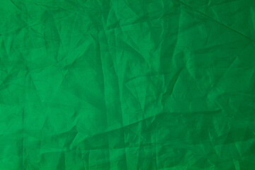 Photo texture of crumpled green fabric
