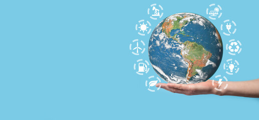 3D Earth planet globe in man, woman hand, hands on blue background. Environmental protection concept. Elements of this image furnished by NASA