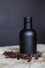 Black Luxury cosmetic bottle packaging on black background on wooden table witn coffee beans around