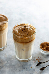 Iced dalgona coffee, frothy creamy whipped coffee cold drink