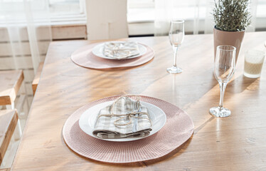  Empty plate and silverware set on wooden table