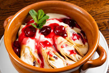 crepes with cottage cheese and berry sauce