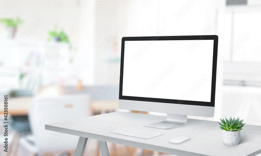 Poster Modern computer display mockup on office desk. Modern studio with clean work desk. Copy space beside. Screen isolated in white