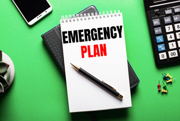 On a green background - a telephone, a calculator and a diary with the inscription EMERGENCY PLAN
