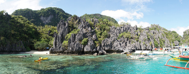 Green lush karst mountains rising out of the ocean on Palawan Island near El Nido, Philippines