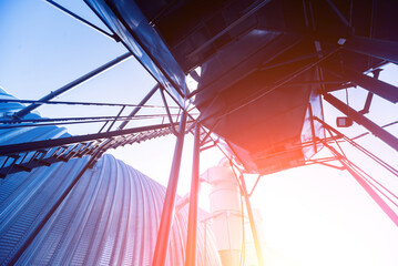 Industrial metallic construction at background with clear sky