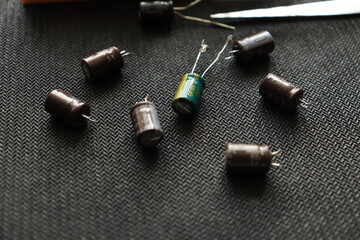  Black background. Isolated capacitor, used in electronic device. Electronic parts concept.