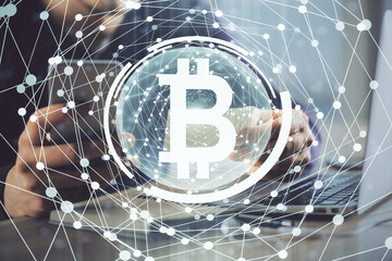 Double exposure of man's hands holding and using a phone and crypto currency blockchain theme drawing.