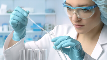 Young female tech or scientist performs protein assay - obrazy, fototapety, plakaty