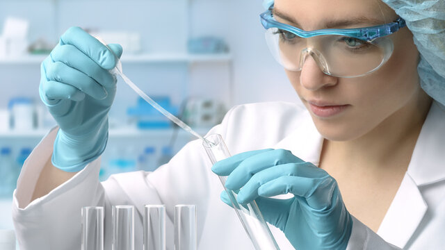 Young female tech or scientist performs protein assay