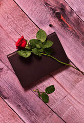 red rose on wooden background