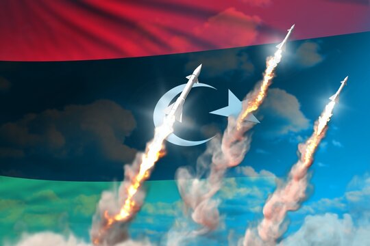 Modern Strategic Rocket Forces Concept On Blue Sky Background, Libya Nuclear Missile Attack - Military Industrial 3D Illustration, Nuke With Flag