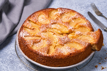 Composition with delicious apple tart on light background.