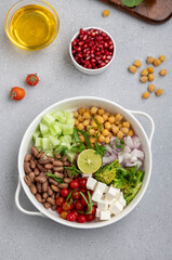 salad made of green veggies, lettuce, cottage cheese, beans, and legumes