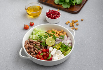 salad made of green veggies, lettuce, cottage cheese, beans, and legumes