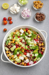salad made of green veggies, lettuce, cottage cheese, beans, and legumes