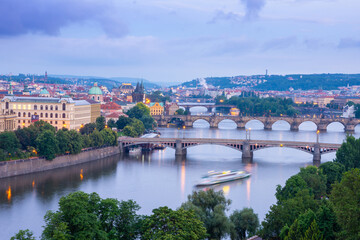 Fototapeta na wymiar view on vltava river with bridges at dusk in Prague in Czech republic