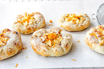 Cheesecake with cottage cheese sprinkled with orange shavings.