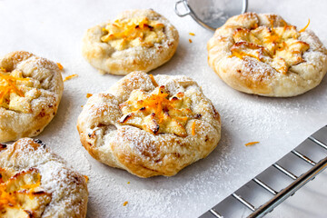 Cheesecake with cottage cheese sprinkled with orange shavings.