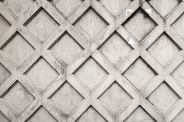 Obraz premium Gray concrete fence with squares decoration