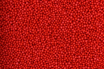 Red foam beads background. Valentine day