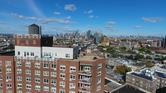 Aerial decent view of the New York Skyline and an apartment complex. 
