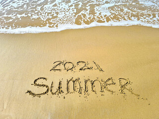 Sea wave washes away the inscription summer 2021