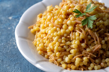 Traditional delicious Turkish food; Couscous pilaf with vermicelli (Turkish name; Sehriyeli kuskus pilavi)