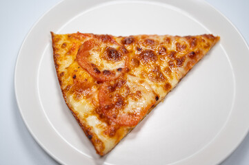Thinly sliced pepperoni is a popular pizza