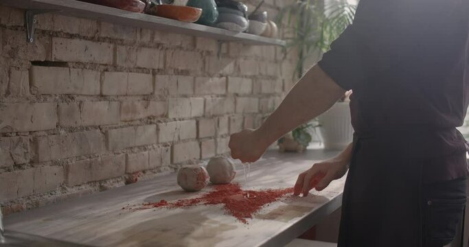 Ceramist mixes dye for kneading colored clay, nerikomi pottery, potter's workshop, 4k 60p Prores HQ 10 bit