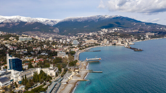 Flying over the Yalta embankment on a Sunny day.