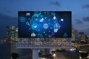 World planet Earth map hologram and social media icons on billboard over night panoramic city view of Singapore, Southeast Asia. Networking and establishing new connections between people. Globe