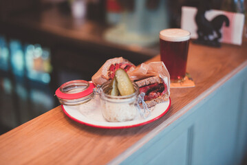 Pastrami sandwich and beer