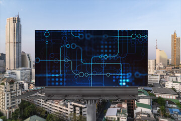 Technology hologram on billboard over panorama city view of Bangkok. The largest tech hub in...