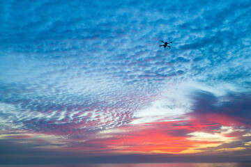Fototapeta premium Drone in the sky at sunrise over the Atlantic Ocean
