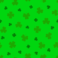Clover leaves seamless pattern. St. Patrick's Day green background with shamrock or clover leaves. Happy Saint Patricks Day symbol.  Colorful flat seamless pattern with stylized clover. Vector.