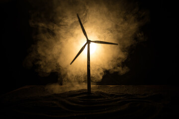 concept idea eco power energy. wind turbine on hill with sunset. Wind Turbine producing alternative energy. © zef art