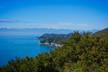 Fototapeta na wymiar Sea from the mountains with blue sea and trees