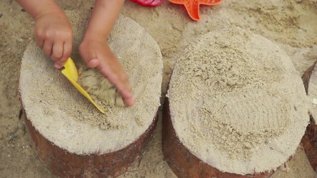 Children activity playing in sandbox playground.