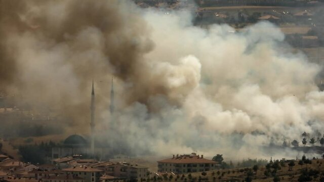 Smoke rises from the area after the terrorist attack. Bomb explodes next to mosques in Muslim country.Terror terrorism attack assault offensive missile rocket fire smoky war fighting wartime warfare