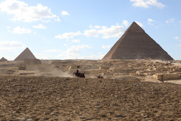 The great pyramids of giza. Tourists in the historic city. Beautiful landscape on a sunny day. View...
