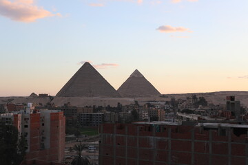 The great pyramids of giza. Tourists in the historic city. Beautiful landscape at sunset. View of...